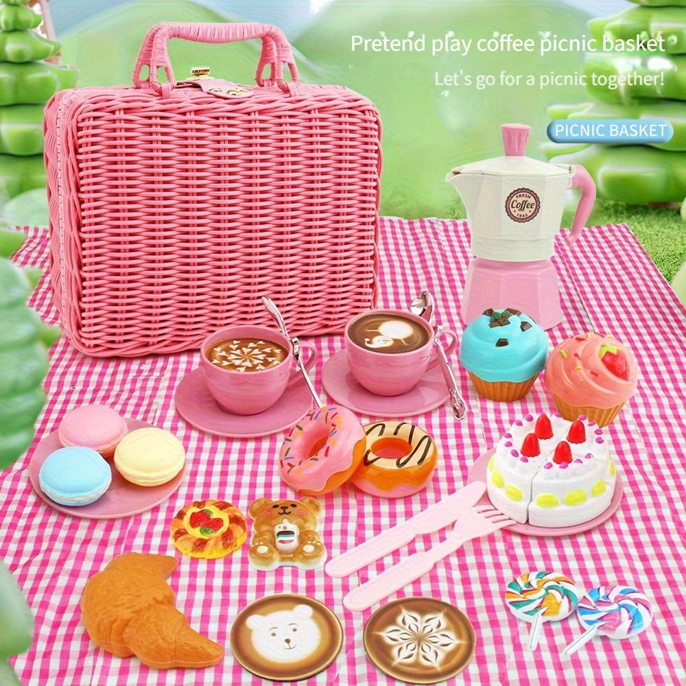 The little girl pretends to play with a picnic basket, tea party set, tea set including coffee machine, cookies, cake, game food