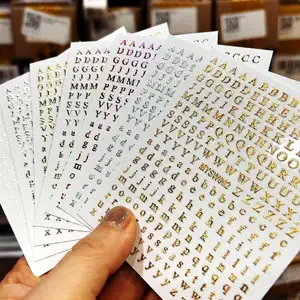 1 Buah Stiker Kuku Alfabet 3D Laser Perak / Emas 26 Stiker Seni Kuku Huruf Inggris Manikur Berperekat 8 * 10cm Stiker Huruf 6 stiker surat emas penjualan terbaik - №