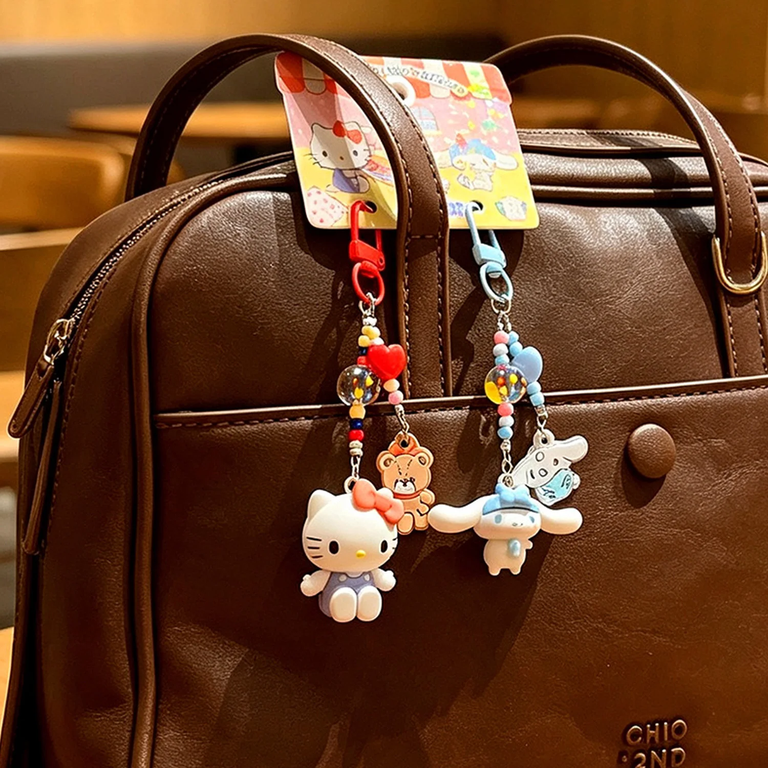 Hallo Kitty My Melody Cinnamoroll Taschenanhänger, bunte Perlenkette, Mini-Figur zur Dekoration von Rucksäcken, Geschenk – Detail 3