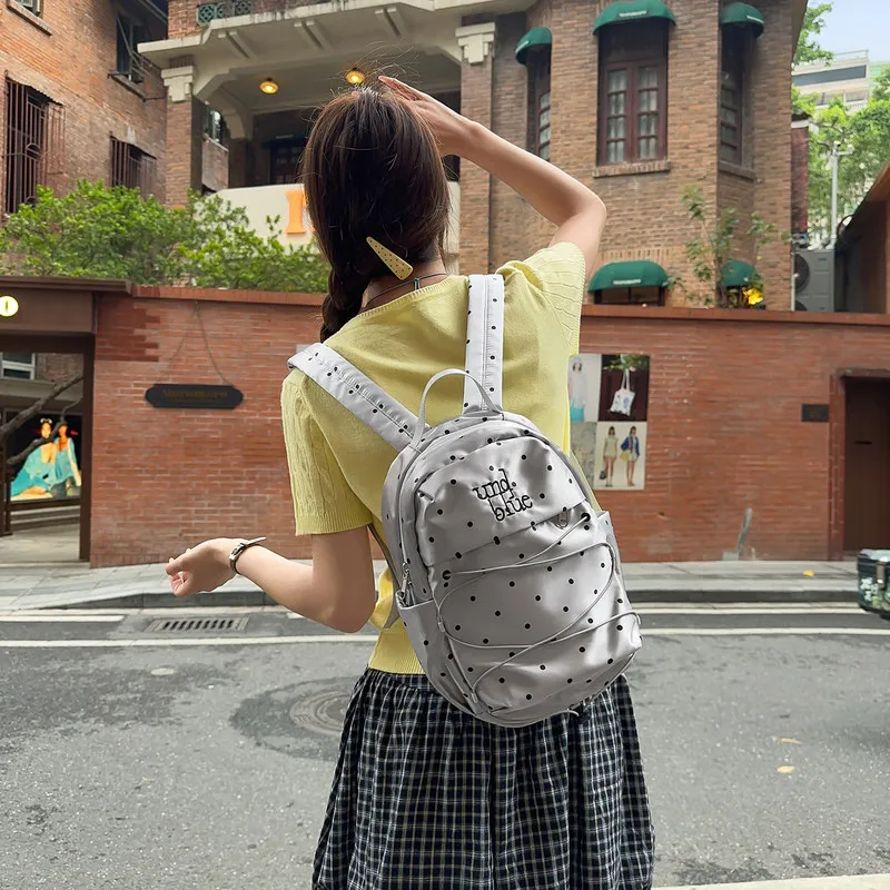 Korean-style polka dot mini backpack for female college students, commuter backpack with high aesthetic value, unique design, li