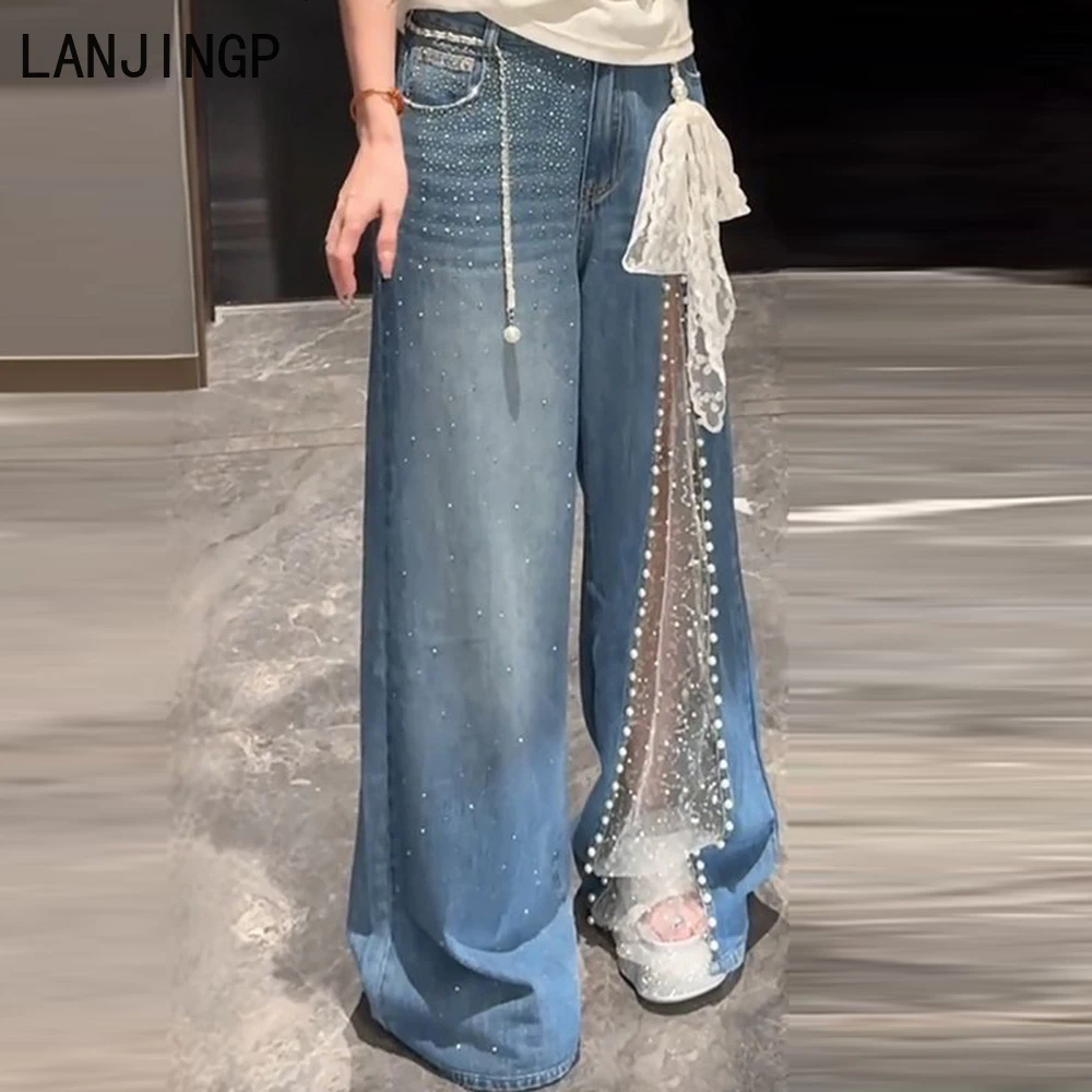 Mantianxing hot diamond mesh stitching heavy industry beaded jeans women's 2025 summer new drape wide-leg pants tide