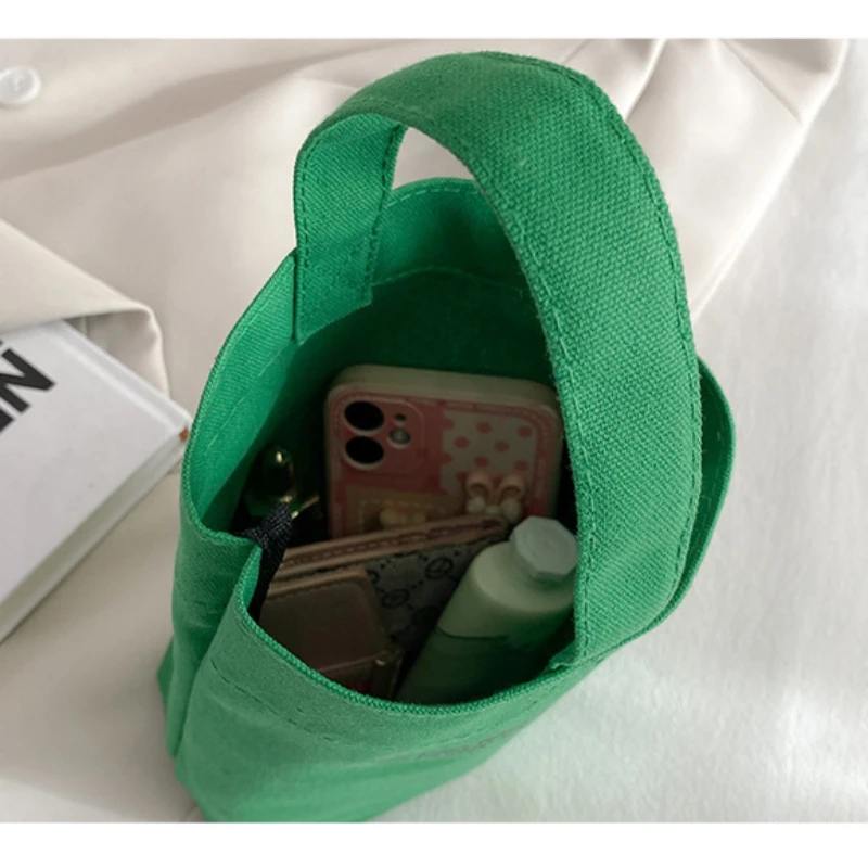 2023 New Minimalist Style Mini Portable Canvas Bag Lunch Bag for Women Handbag Candy Color Kettle Wrist Strap Plain Canvas Bag