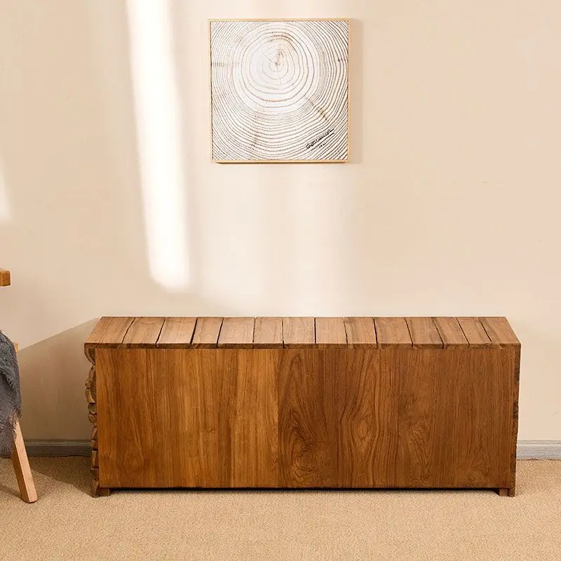 

integrated shoe stool at door of home, entrance cabinet is against wall, and retro storage cabinet