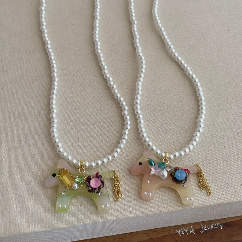 

Minar Cute Candy Color Rhinestones Acrylic Cartoon Horse Pendant Necklaces for Women Simulated Pearl Strand Sweater Chain Choker