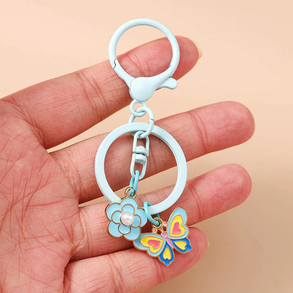 Modische Blumen-Schmetterling-Glocken-Schlüsselanhänger für Autoschlüssel, Damen- und Herren-Handtaschenanhänger, Schlüsselringe, Accessoires, DIY-Schmuckgeschenke – Detail 8