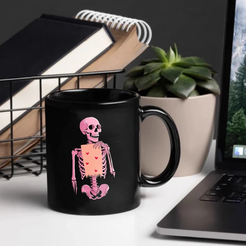 Black ceramic cup with a pink skull holding heart pattern, suitable for Halloween and Valentine's Day