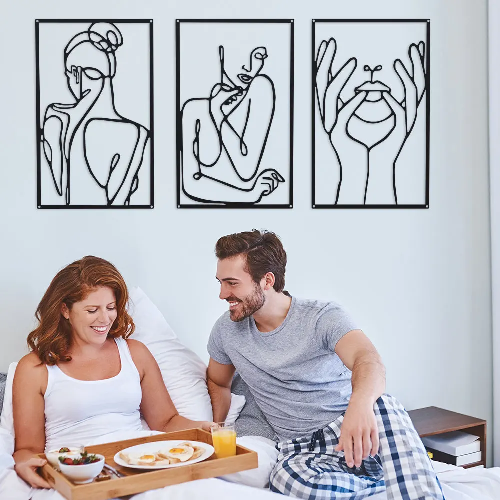 modern gallery display. Minimalist 3-Piece Metal Wall Art: elegant continuous-line silhouettes create a captivating