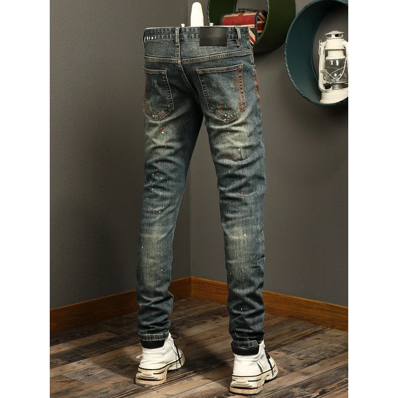 

Black splashed ink printed jeans with men's ripped patch, retro trend street elastic slim fit small leg pants