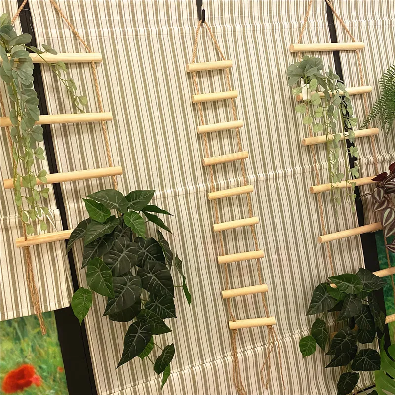 

Handmade decorative items made of hemp rope, wooden ladder and wooden stick for home wall hanging can be used to hang hats and s