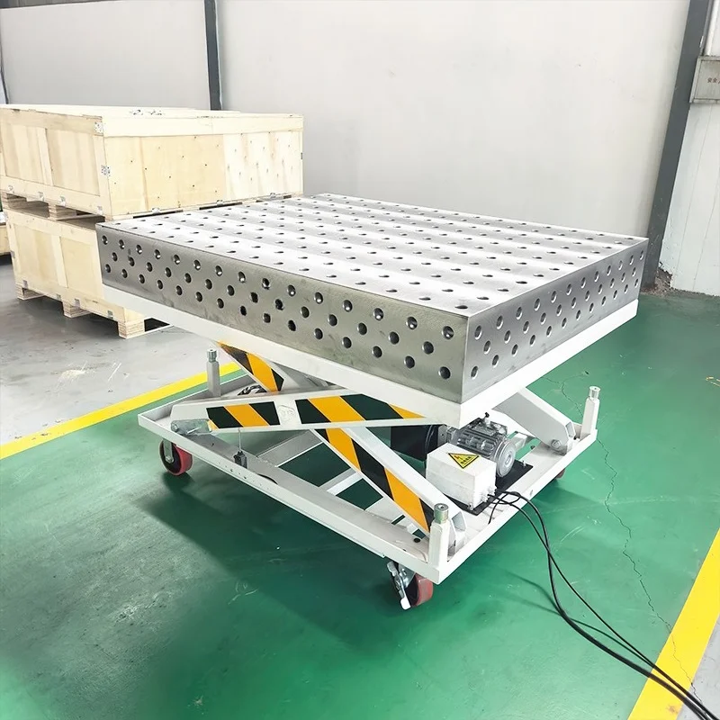Electro-hydraulic lift welding table with powerful shear legs and locking casters