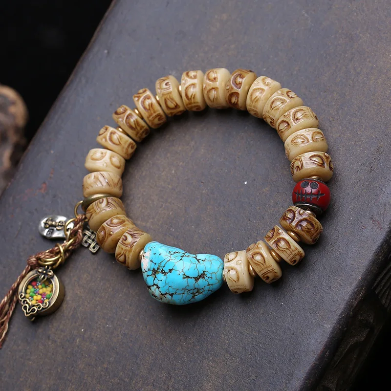bracciale-vintage-con-perle-di-osso-a-forma-di-buddha-perle-di-turchese-irregolari-e-ciondolo-laterale-in-rame-gahu
