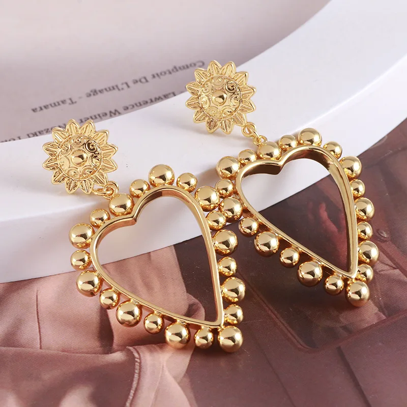 European and American style relief sunflower hollow love earrings