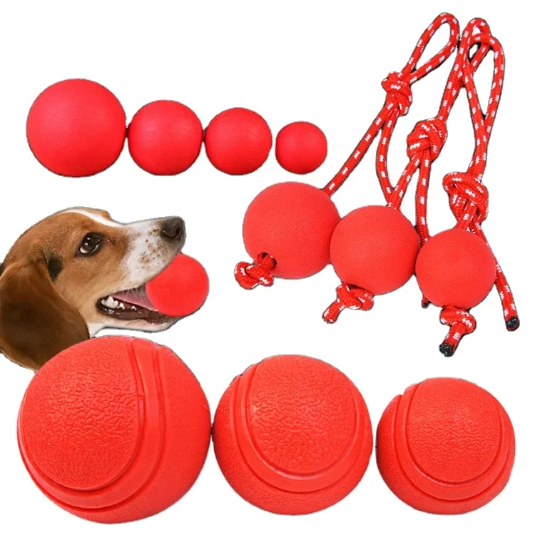 

Manufacturer wholesale red dog ball Training dog chewing solid rubber elastic ball wearing rope pet toy with rope elastic ball