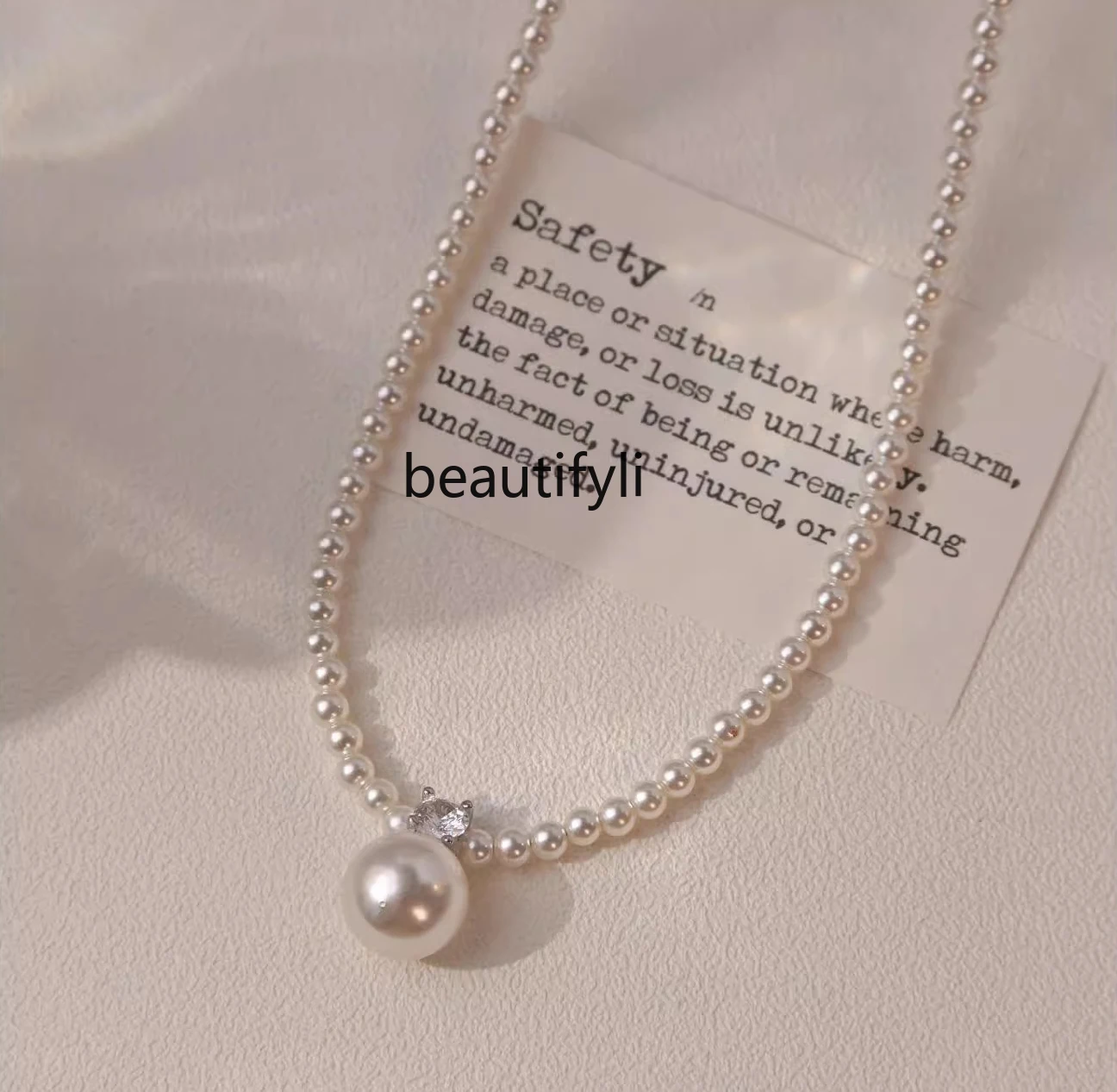 

Premium millet pearl necklace women's new popular light luxury niche design neck chain spring and summer sweater chain