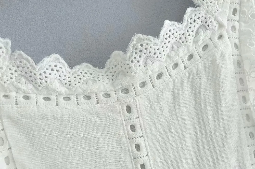 Nowa letnia moda damska 2026, casualowy kombinezon z koronkowymi wstawkami, długie spodnie z odkrytymi plecami i wycięciami.