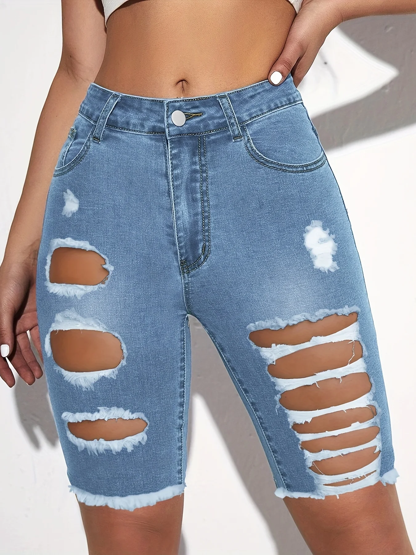 Women\'s fashion jeans with holes in them