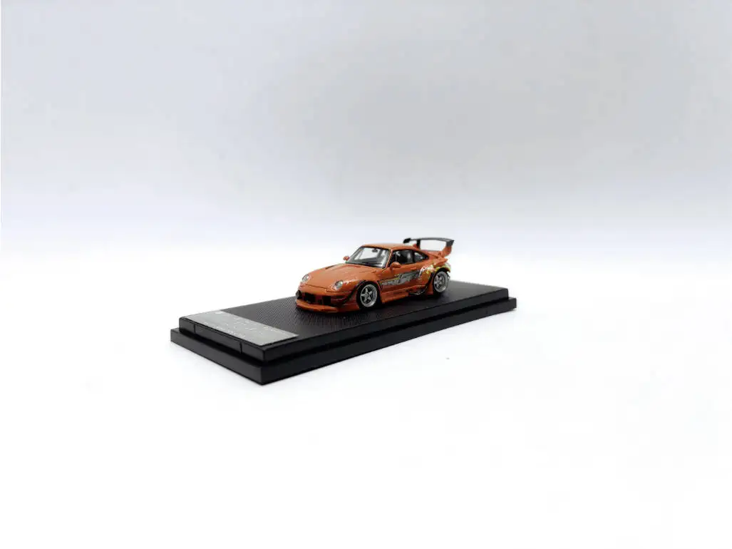 

In Stock Street Warrior 1:64 RWB 993 Diecast Model Car. Vibrant orange finish with custom flame graphics, iconic widebody design