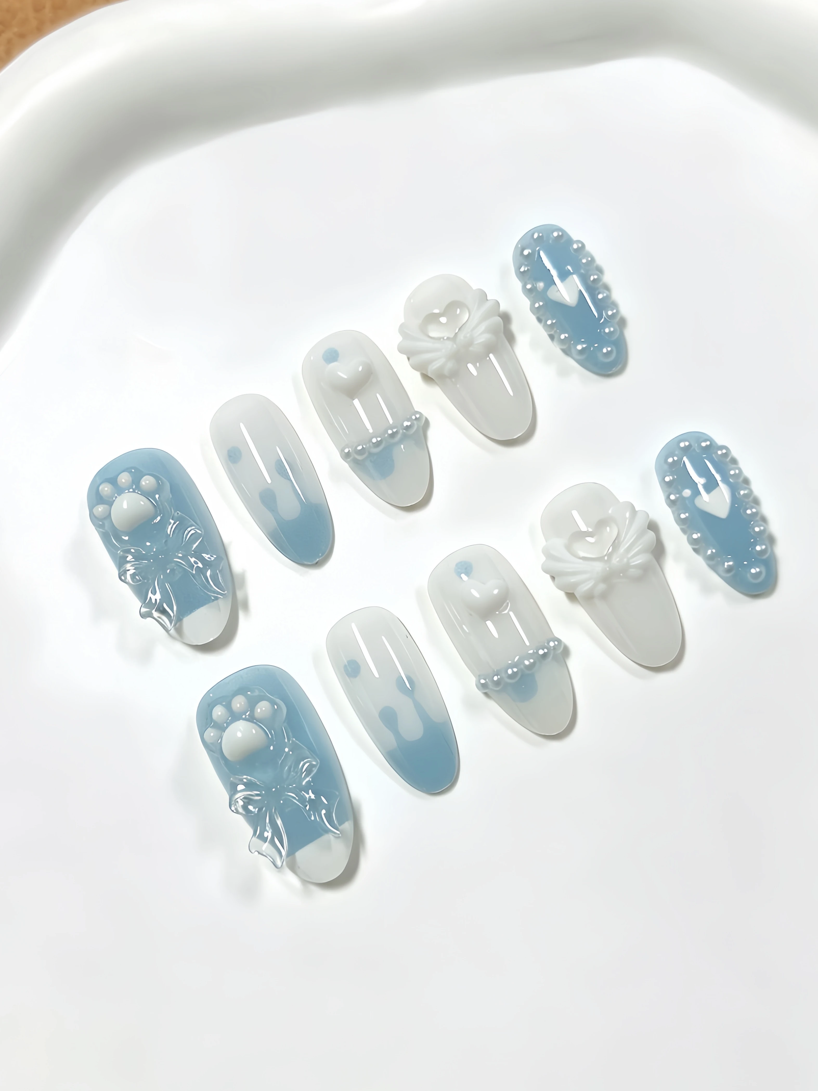 10 Medium-Length Almond-Shaped Nails, with Main Colors in Milky White and Light Blue, Decorated with Transparent Milky White Cat Paw Bows, Heart Wings, Rhinestones, Pearls, Water Droplets, and Stripes. Korean-Style Ins-Style Cute Sweet Girl and Mature Lady Nail Art, Versatile Fake Nails for Banquets, Birthdays, Daily Outings