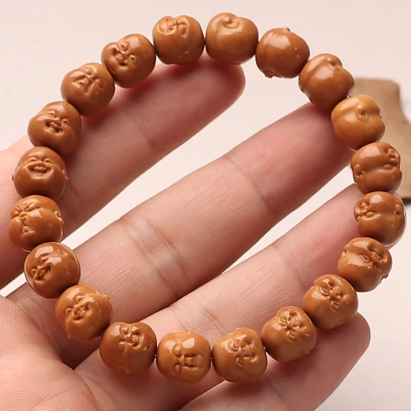 Life is full of surprises; this hand-carved monkey head and peach pit bracelet is a delightful piece of art, perfect for collect