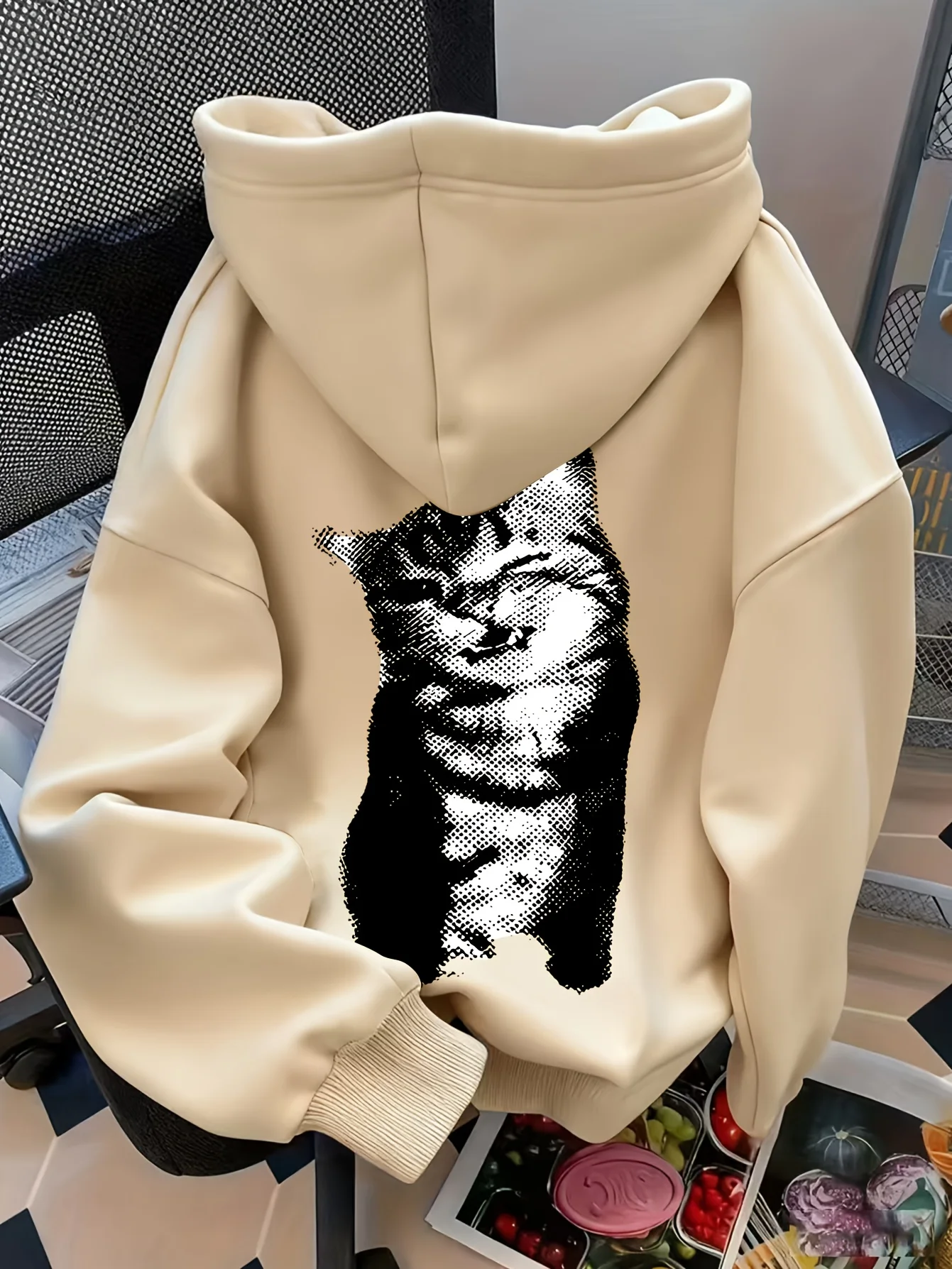 Printed patterned women's pullover sweater with hood and sweatshirt style. With kangaroo pockets. Fall/Winter collection.