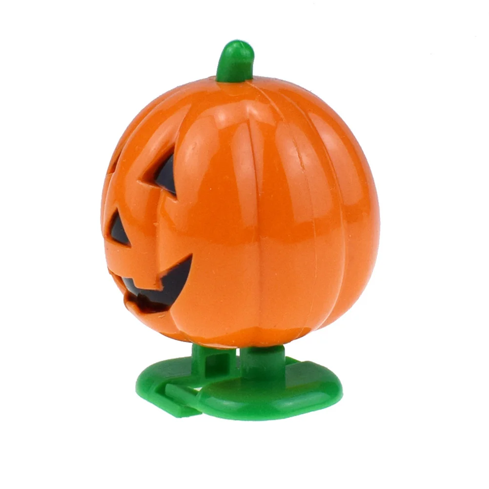 4 pezzi di giocattoli da afferrare zucca di Halloween colore brillante orologeria carica sorriso viso