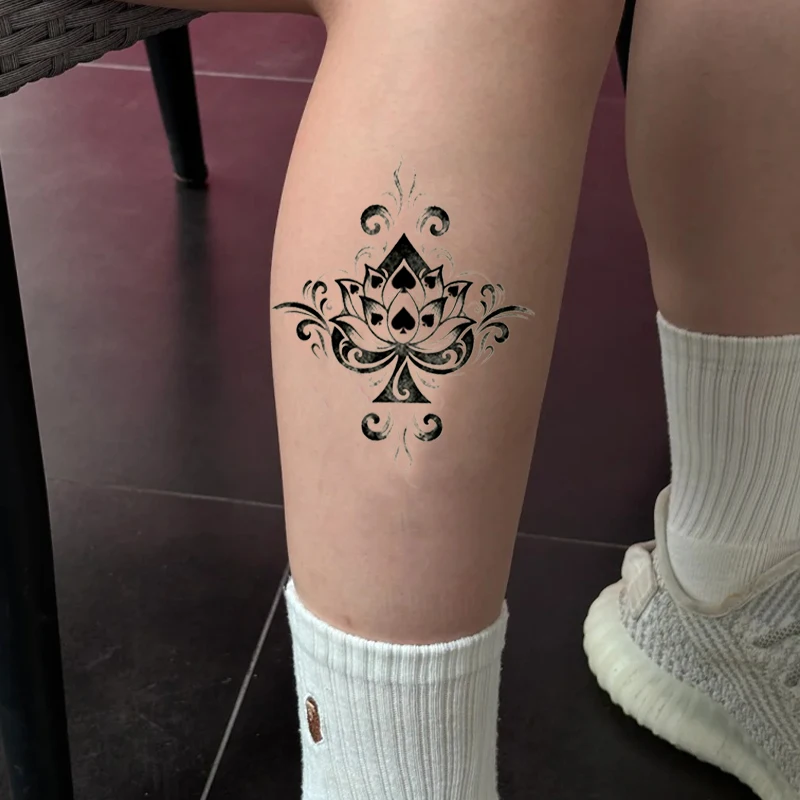 Bridal Ankle Elegance: A 'Something Black' Lotus Tattoo for the Modern Bride