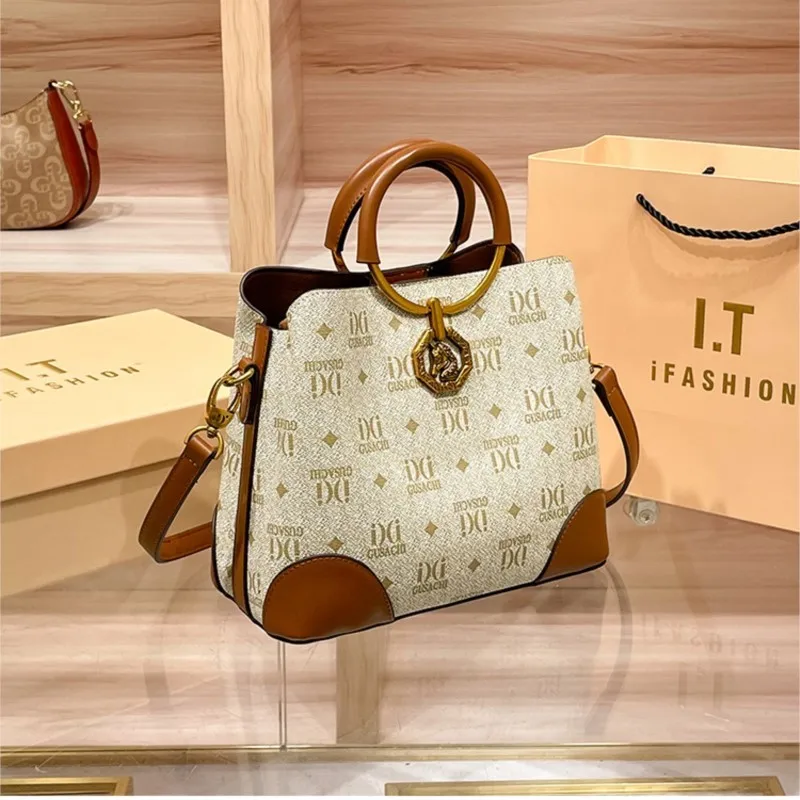 Brand Light Luxury Women's Bag 2027 New High end Retro Bucket Bag Rivet Embroidered Handheld Single Shoulder Diagonal Cross Bag