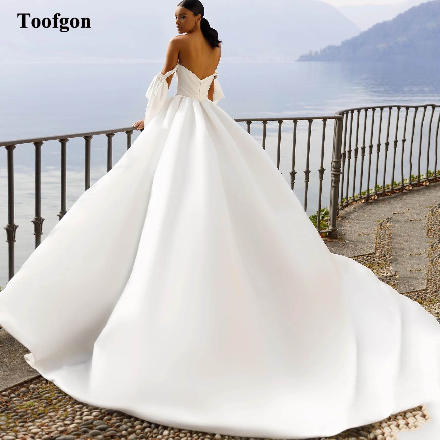 

Toofgon A Line Satin Wedding Dresses Bow Straps Off The Shoulder Formal Bride Wedding Gowns Pleats Beaded Princess Bridal Dress