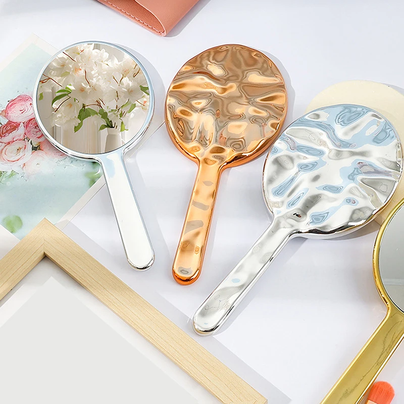 Vloeibare ellipsofvormige spiegel Handbediende desktop cosmetische make-upspiegel Reizen Draagbare schoonheid Glanzende zilveren spiegel voor handtas