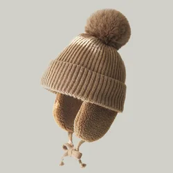 Gorro grueso de invierno para bebé, Gorro con pompón grande con orejeras, gorro de punto de felpa para niños y niñas, accesorios cálidos para niños, 2-8T