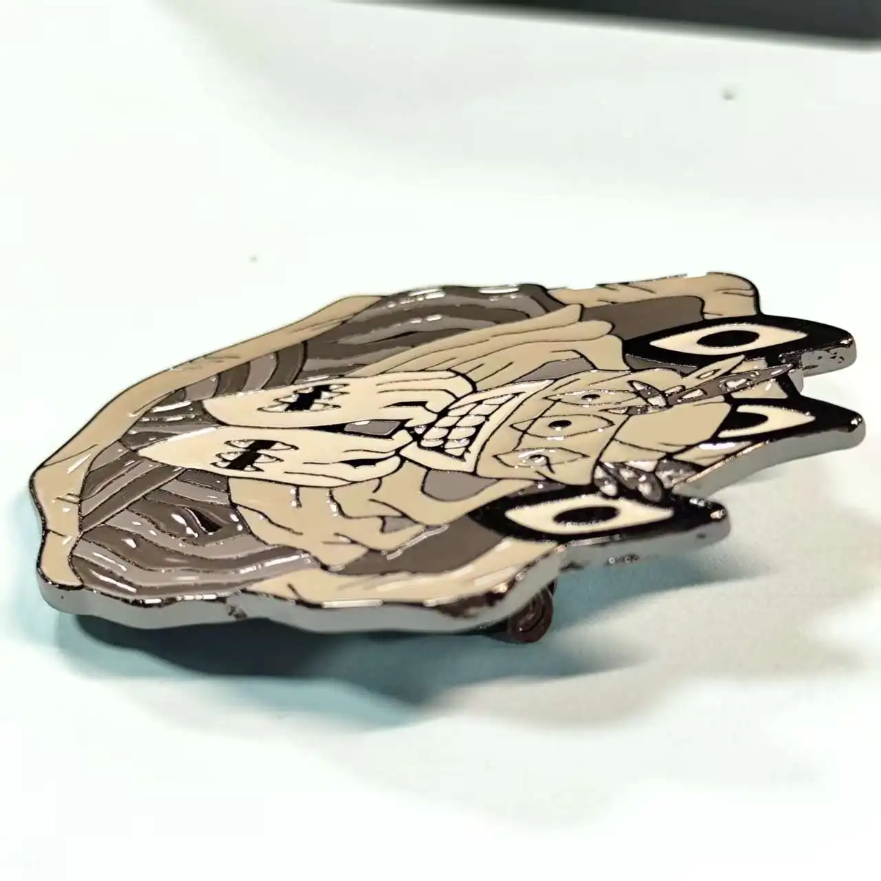 Anime - inspired enamel pin with a strange character. Cool collectible for fans, easy to pin on items.