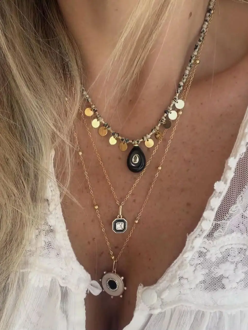 Popular in Europe and America, this stainless steel beaded necklace features a black agate drop pendant with speckled stones