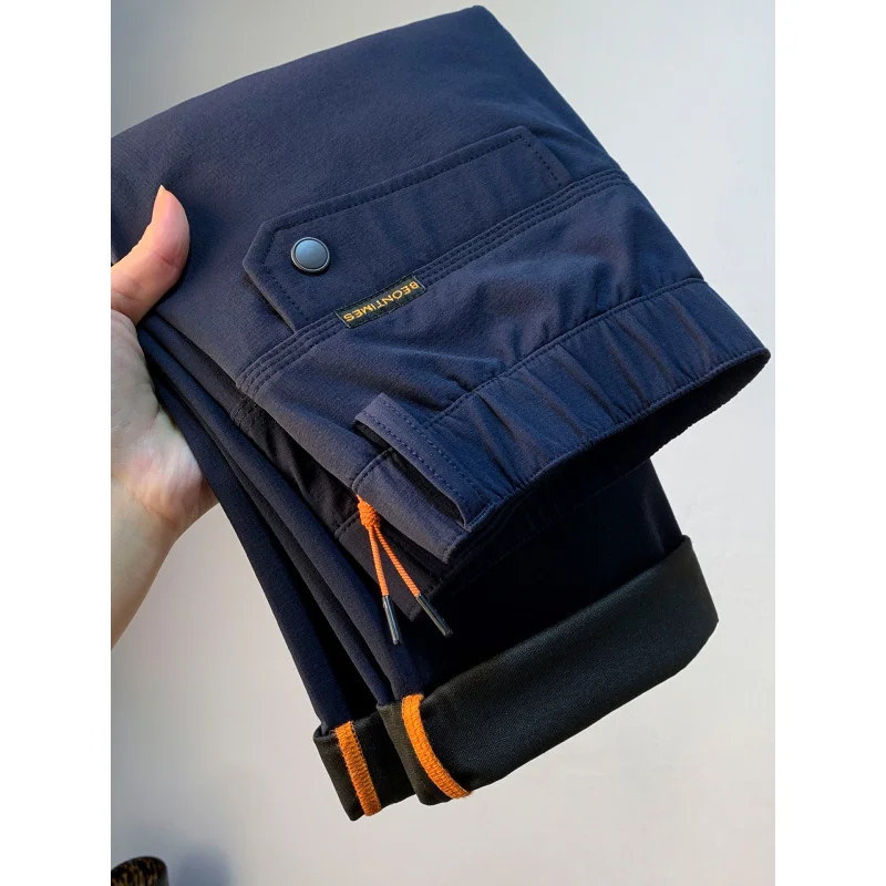 Pantaloni casual da uomo larghi a tubo dritto per la primavera e l'autunno 2025, pantaloni da pendolarismo alla moda da uomo elastici con tasca con cerniera di tendenza