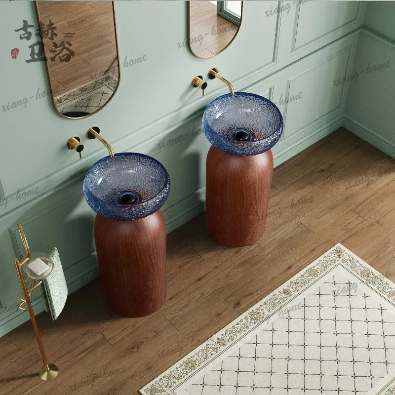 Floor-to-ceiling column, sink, walnut base, blue glass basin, bathroom sink