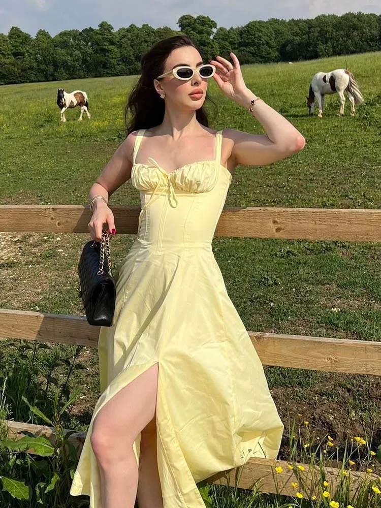 YENKYE 2023 Women French Style Yellow Sling Dress Sexy Sleeveless  Cross Lacing Up Back  Slit Hem Elegant Ladies Dresses