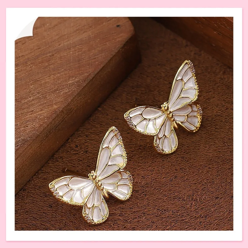 

Korean Version Fashionable Simple Small Fresh White Dripping Oil Smart Butterfly Stud Earrings Light Luxury Temperament High-end