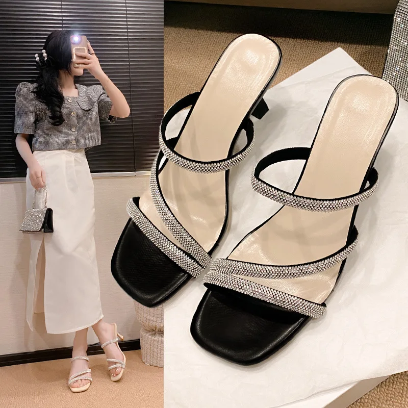 

Fairy Wind Cool Slippers Female Summer Wear 2025 New Rhinestone One-word Drag Temperament High Heels Large Size Stiletto Sandals