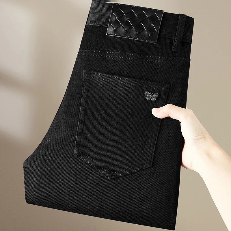 Pure black jeans men's 2025 new light luxury fashion spring and summer versatile elastic slim fit small straight leg pants