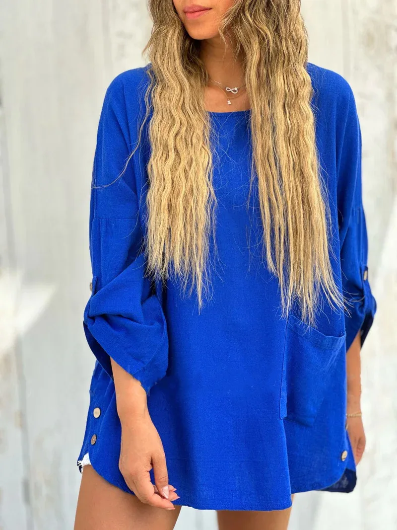 2025 ฤดูร้อนใหม่ชุดสตรีอารมณ์สง่างามสบายๆสีทึบหลวมรอบคอปุ่มแขนยาว Midskirt ชุด