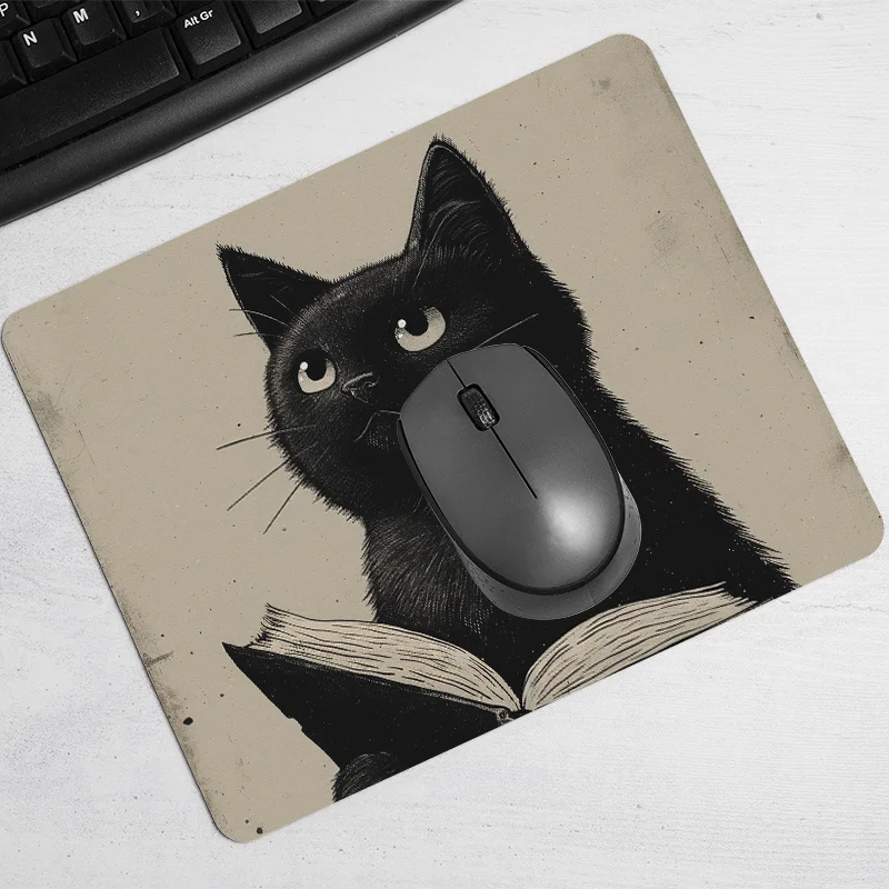 Black cat reading design pattern mouse pad with a rubber base and anti-slip desk pad is suitable for both office and home use