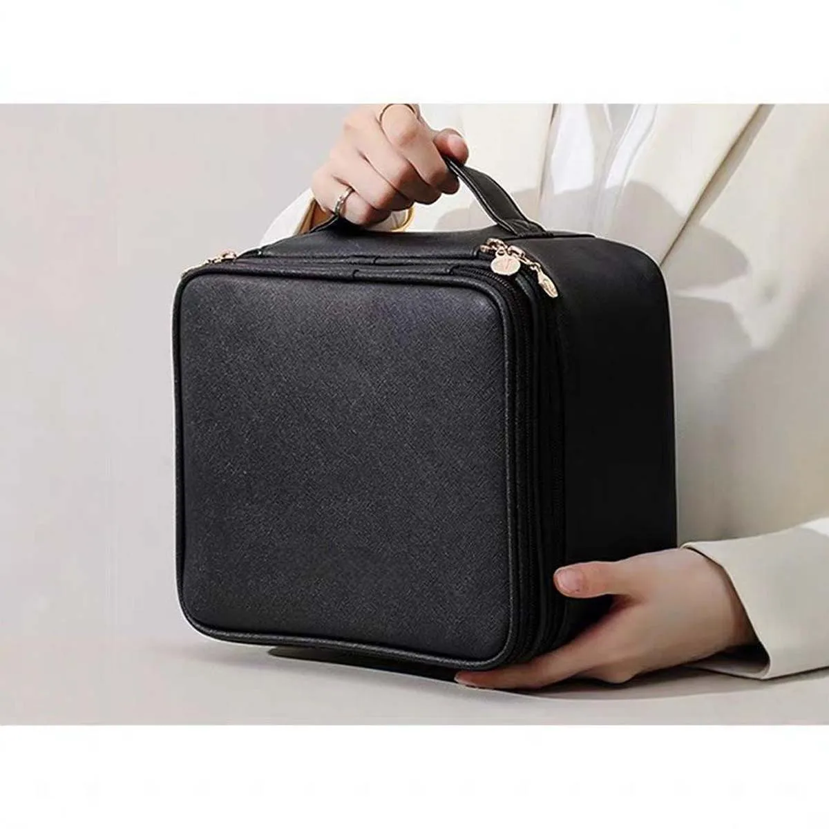 The new double-layer fashionable PU makeup bag is a portable hand-held storage bag with a large capacity and multiple compartmen