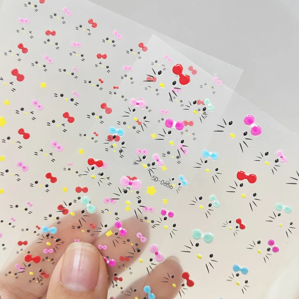 2 fogli simpatico gattino faccia adesivi per unghie cartone animato 5D fiocchi rosa pentagramma felice decalcomanie per unghie fai da te Y2K dolci ragazze inverno unghie Decor
