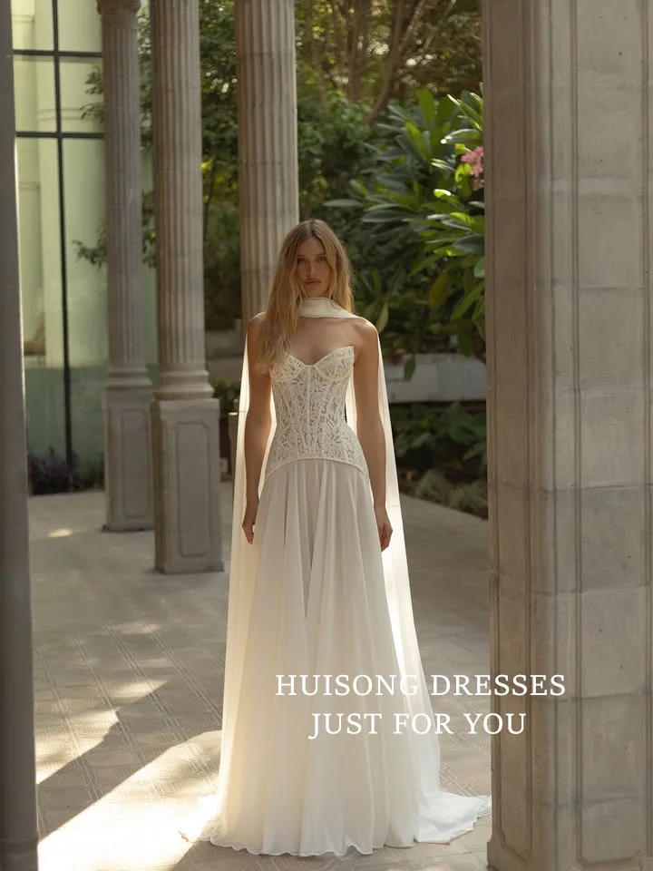 HUISONG カスタマイズされたボヘミアンシフォンウェディングドレス レースアップリケ スイートハート ノースリーブ Aライン ビーチ ブライダルドレス vestidos de novia