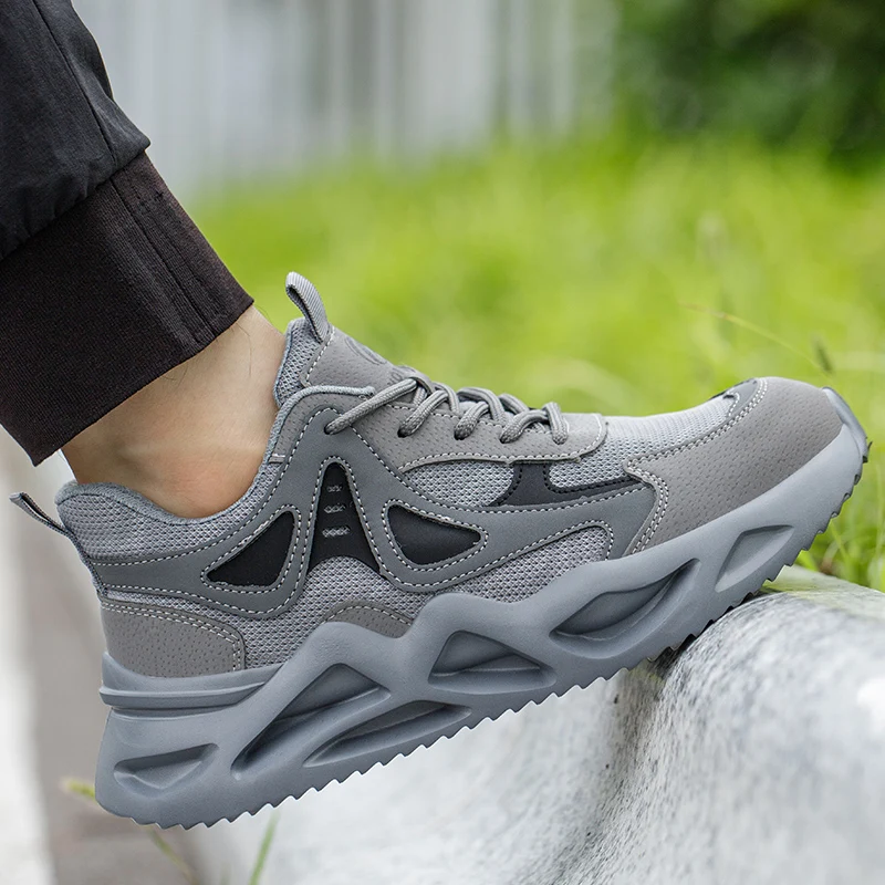Scarpe antinfortunistiche moda uomo con puntale in acciaio Anti-smash nuove scarpe da lavoro da uomo Sneakers scarpe indistruttibili a prova di
