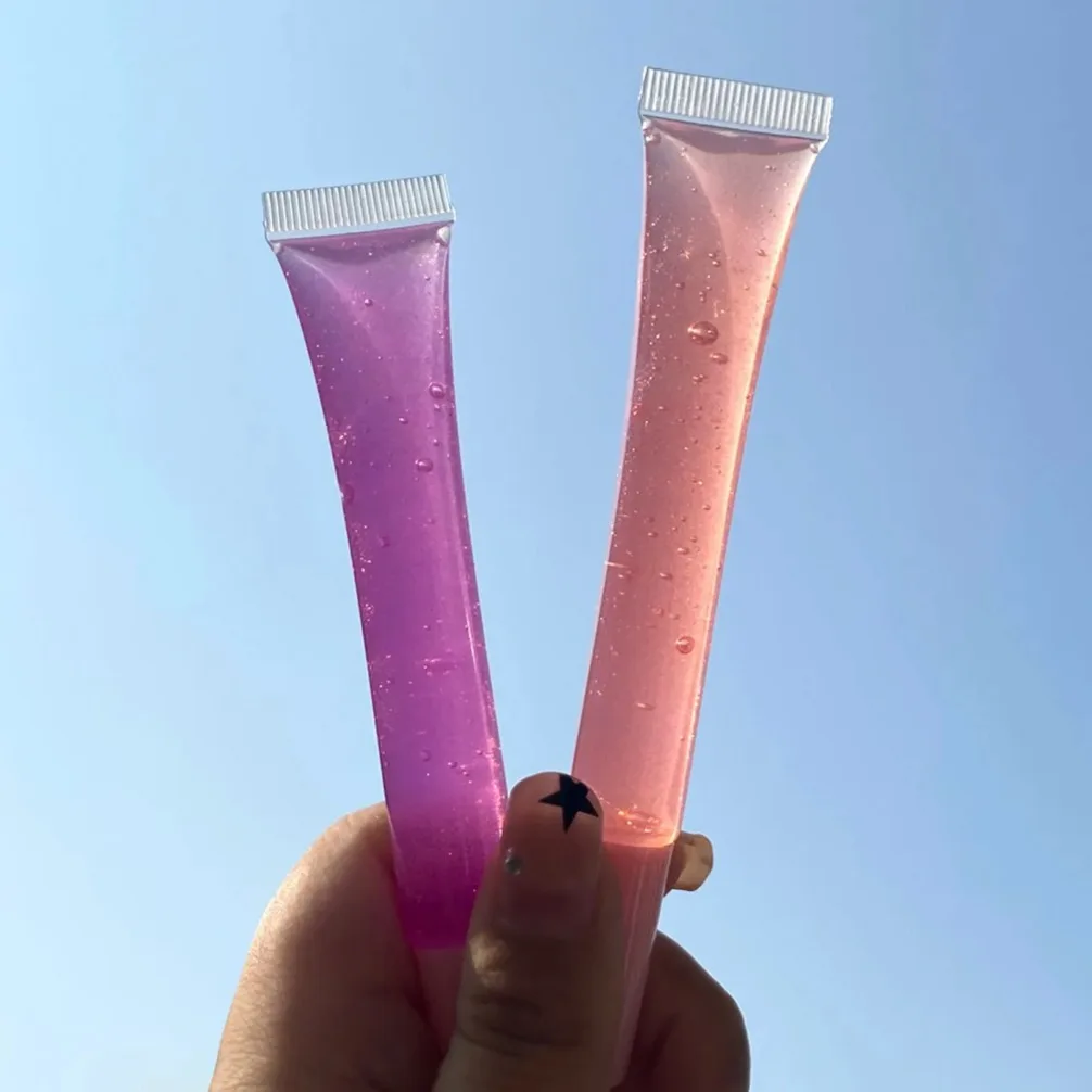 프라이빗 라벨 맞춤 로고 도매 메이크업 레인보우 과일 립글로스 시어 컬러 립밤 소프트 튜브 건조함 보습 립 오일