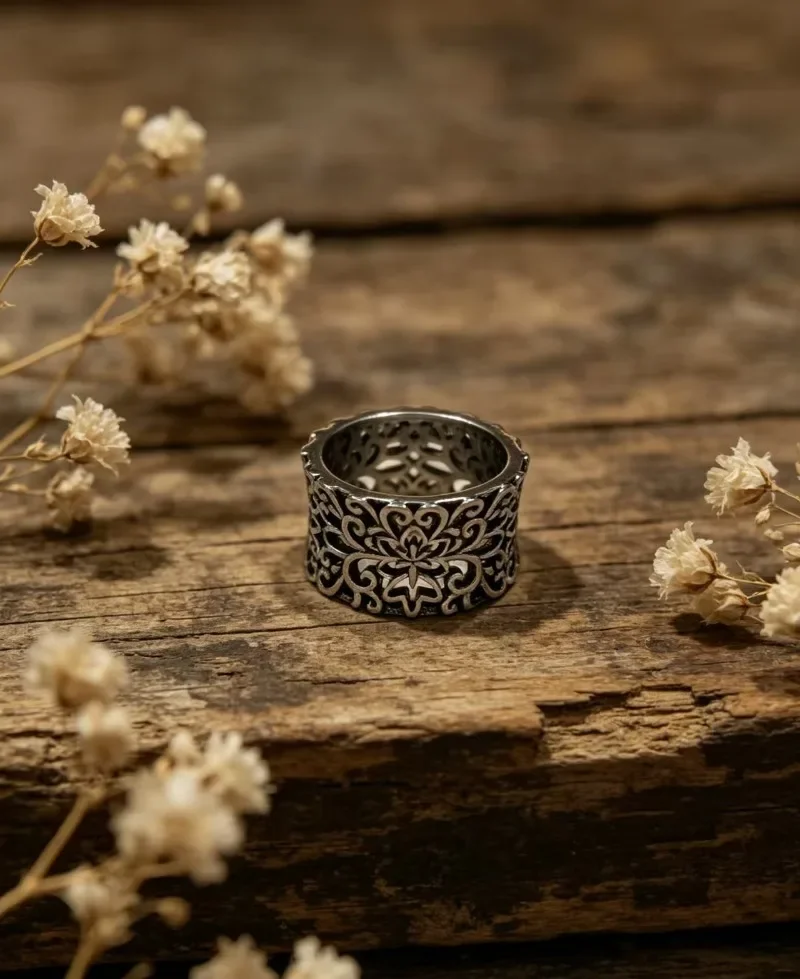 Retro embossed floral design, trendy women’s piece with irregular patterns, finger ring accessory.