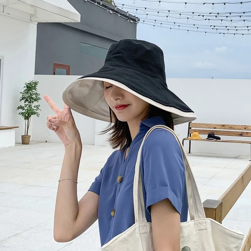 A fashionable and versatile black fisherman's hat for women with big face