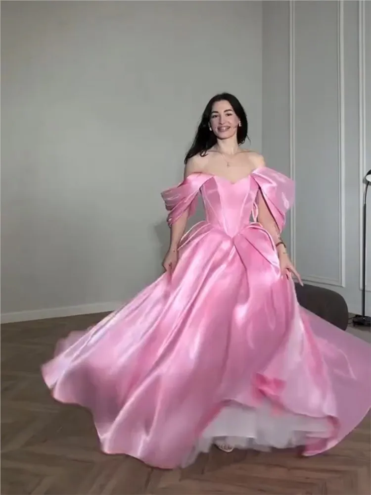 A new pink satin dress that is simple lightweight and for students