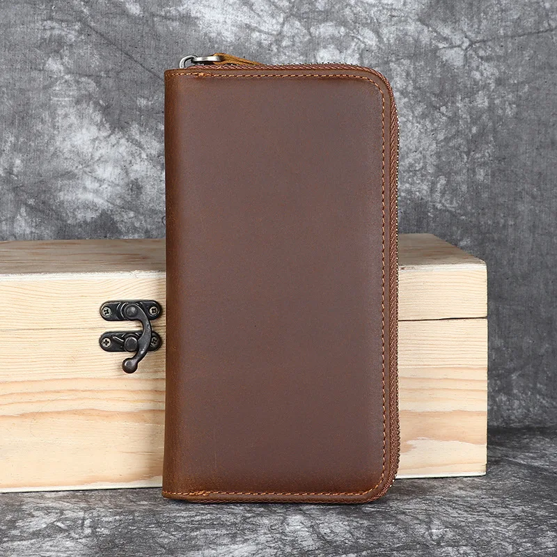 Leather men's long-handled handbag made of top-grade cowhide, with a zipper closure. An elegant retro handmade casual money clip