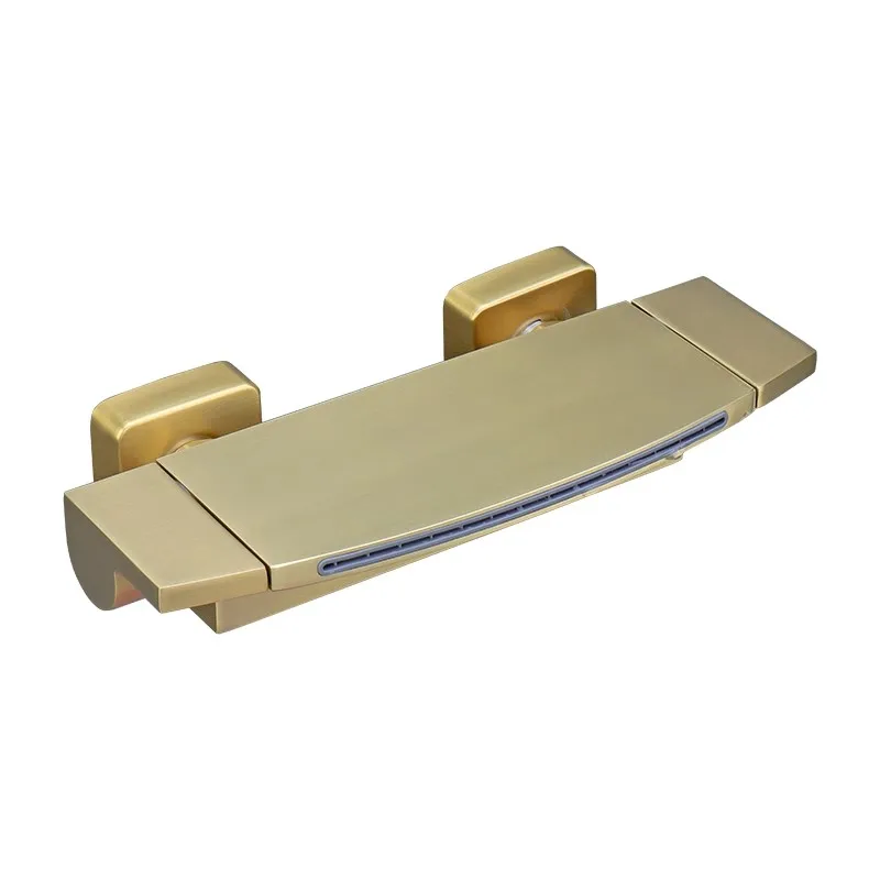 

L The bathtub faucet is a simple wall mounted waterfall style water outlet with dual handles made of copper and gold.